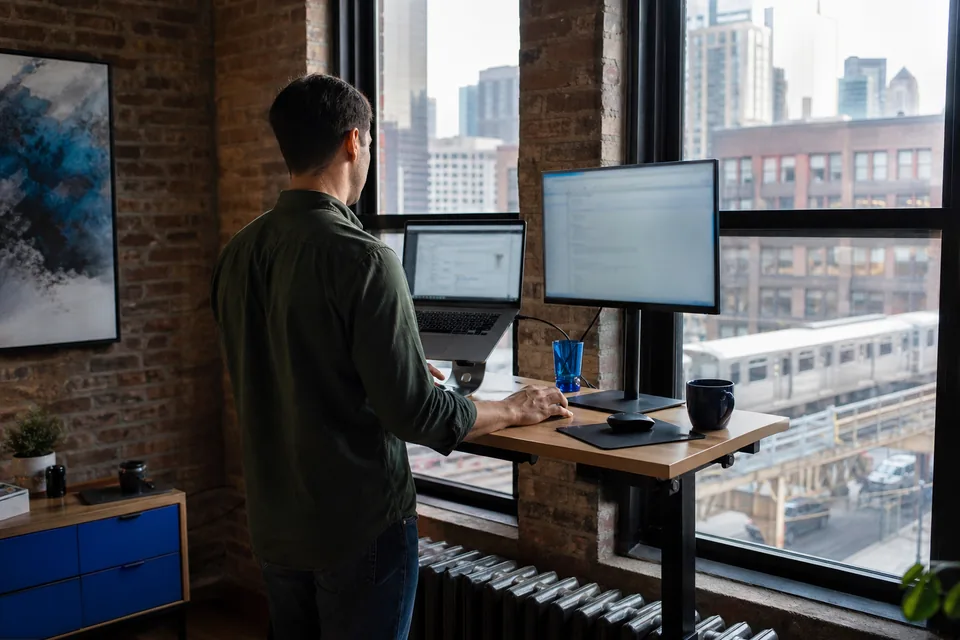Remote worker at a standing desk in a Chicago apartment